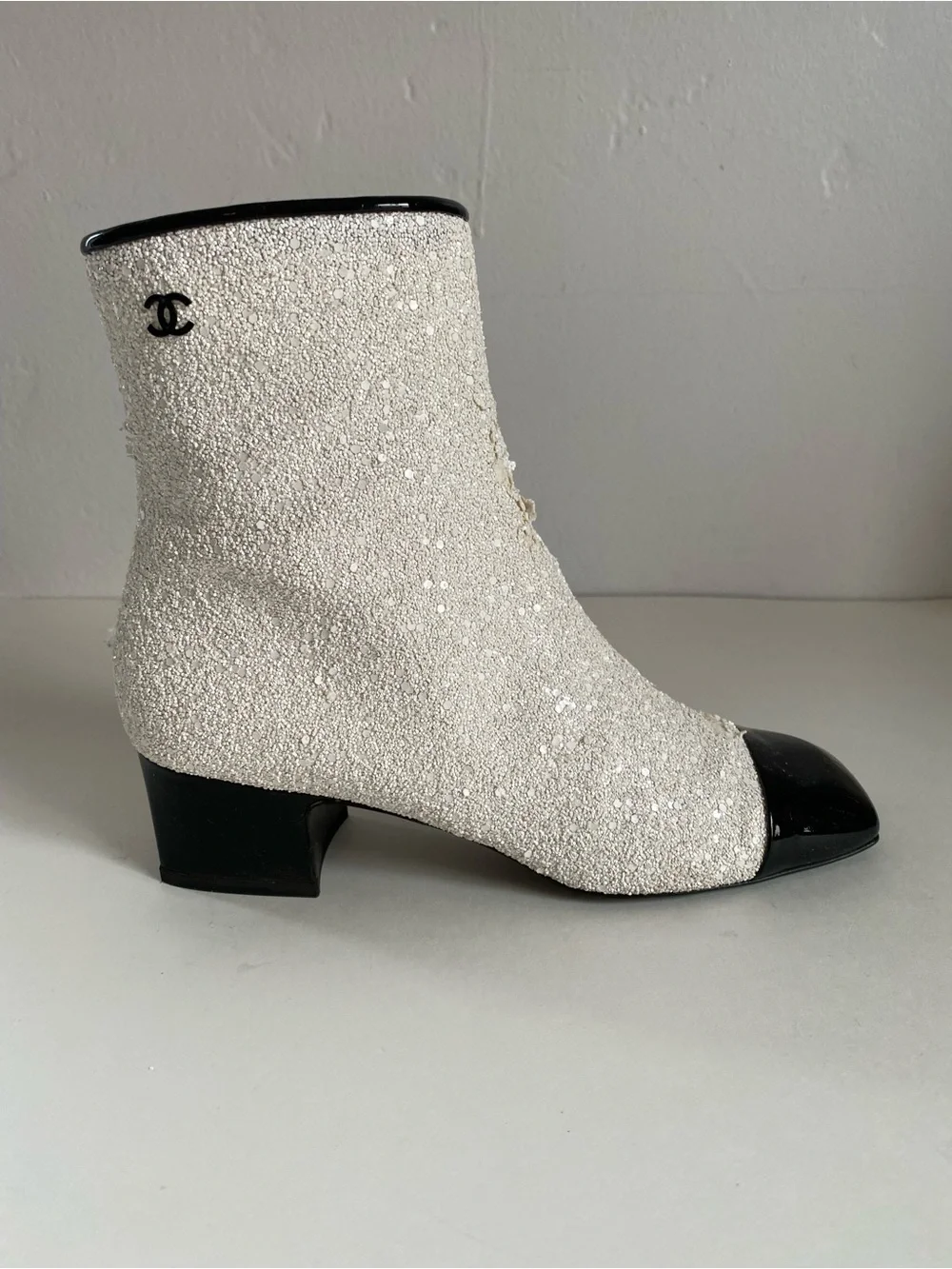 CHANEL White Sequin Ankle Boots with Black Cap Toe. Runway astronaut collection.